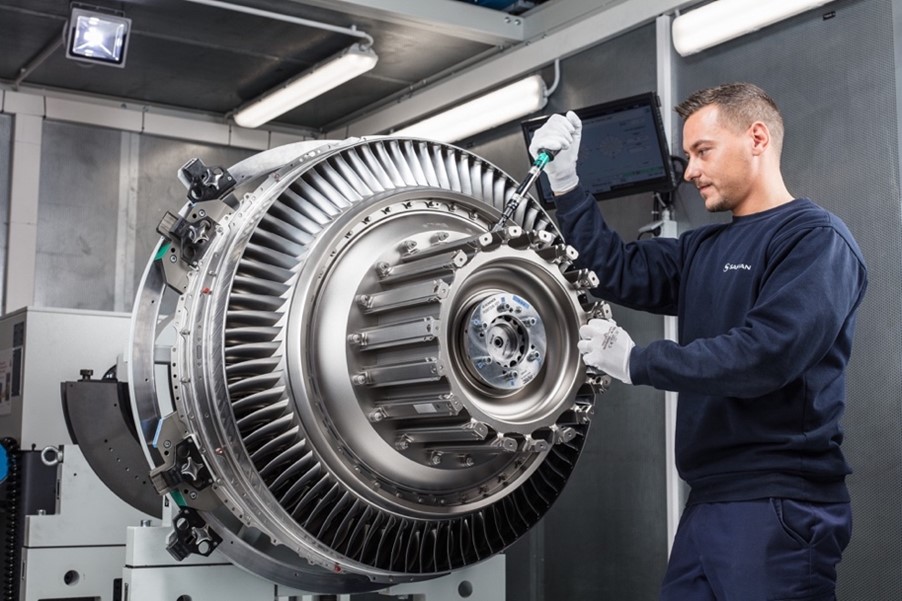 A picture of an engineer working on a turbine